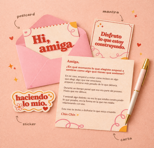 Greeting card with envelope, pen, and motivational text on a pink background